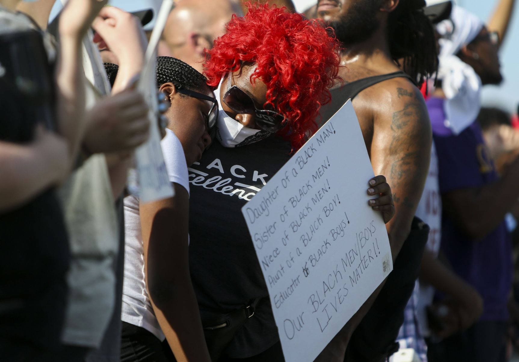 Protesters march down Highway 67